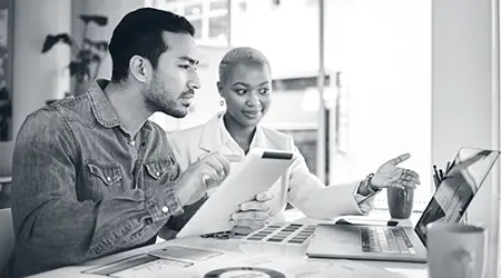 Team discussing data insights during a strategic research and organizational assessment session.