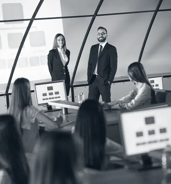 Leaders presenting insights to a group during strategic research consulting session