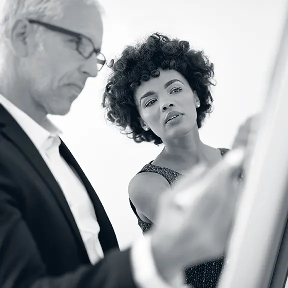 Leader receiving one-on-one coaching during an organizational planning session.